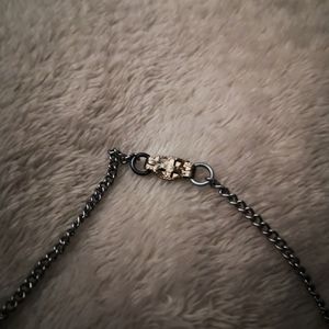 Intricate silver tone necklace